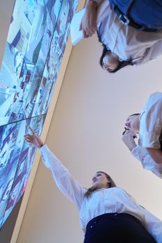 group of female security operators working in a data system control room  Technical Operators Working at  workstation with multiple displays, security guards working on multiple monitors in surveillance room, monitoring cctv and discussing