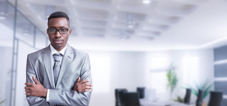 Portrait of young junior businessman in front of his big modern office