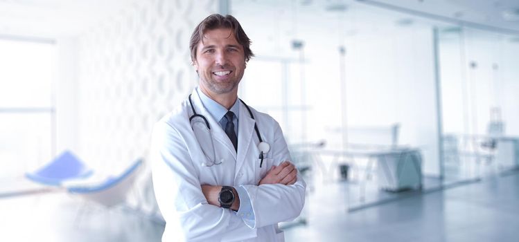 Portrait of smilling senior doctor of medicine in his ordination