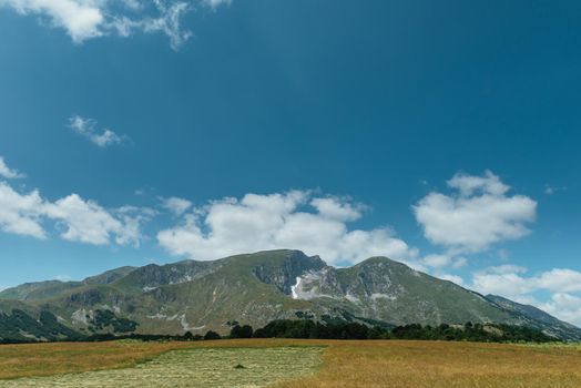 Amaizing sunset view on Durmitor mountains, National Park, Mediterranean, Montenegro, Balkans, Europe. Bright summer view from Sedlo pass. Instagram picture. The road near the house in the mountains