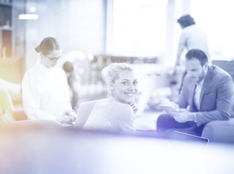 Group of a young business people discussing business plan at modern startup office building