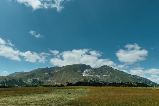 Amaizing sunset view on Durmitor mountains, National Park, Mediterranean, Montenegro, Balkans, Europe. Bright summer view from Sedlo pass. Instagram picture. The road near the house in the mountains