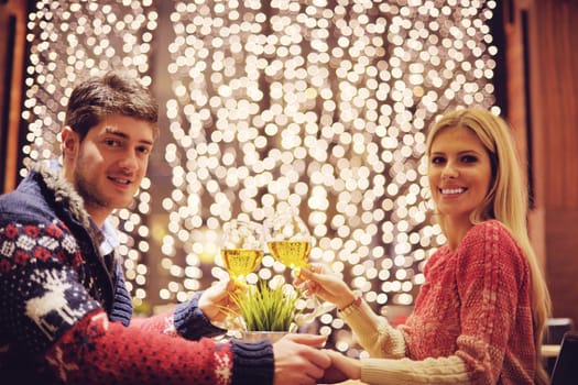 romantic evening date in restaurant  happy young couple with wine glass tea and cake