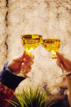 romantic evening date in hotel room, or supper in restaurant, happy couple with wine glass