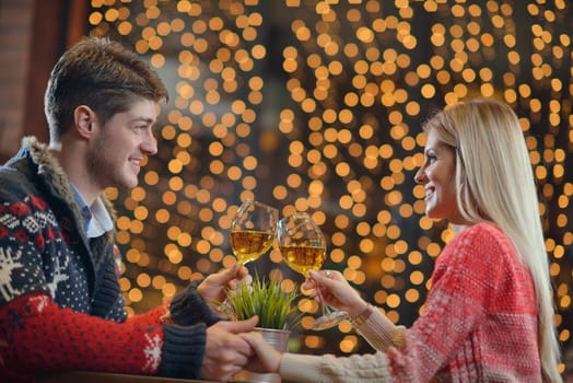 romantic evening date in restaurant  happy young couple with wine glass tea and cake