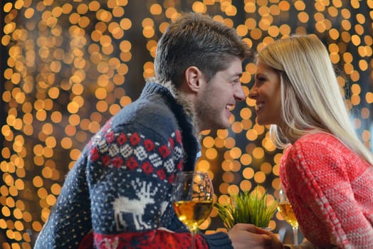 romantic evening date in restaurant  happy young couple with wine glass tea and cake