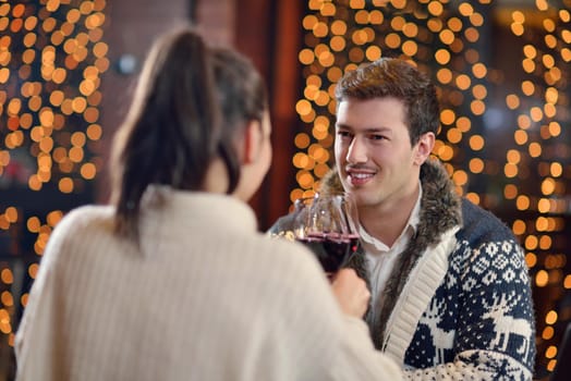 romantic evening date in restaurant  happy young couple with wine glass tea and cake