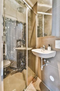 Interior design of an elegant bathroom with shower tall