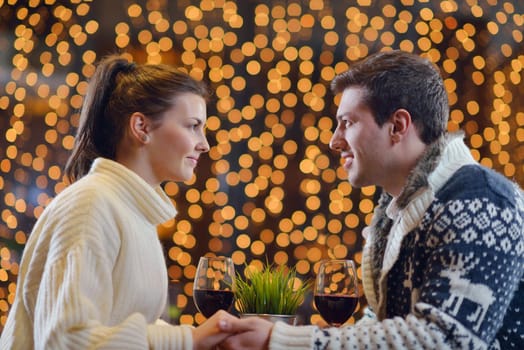 romantic evening date in restaurant  happy young couple with wine glass tea and cake