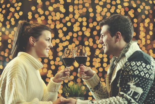 romantic evening date in restaurant  happy young couple with wine glass tea and cake