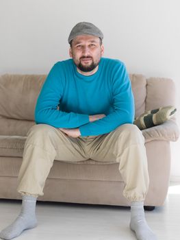 happy young  man  relaxing at bright home livingroom