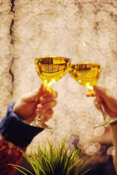 romantic evening date in hotel room, or supper in restaurant, happy couple with wine glass