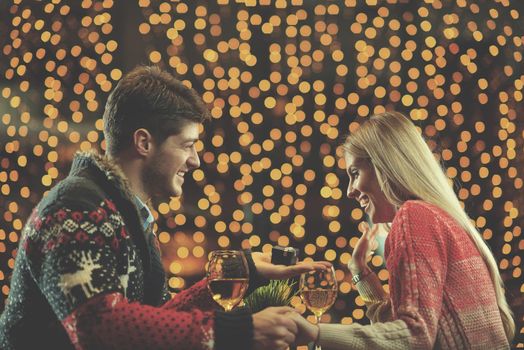 The young man gives a wedding ring   gift to  girl in restaurant