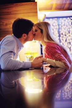 romantic evening date in restaurant  happy young couple with wine glass tea and cake