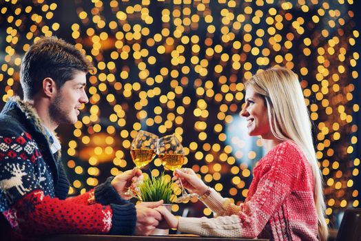 romantic evening date in restaurant  happy young couple with wine glass tea and cake