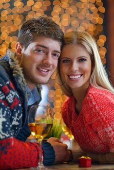 romantic evening date in restaurant  happy young couple with wine glass tea and cake