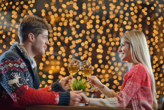 romantic evening date in restaurant  happy young couple with wine glass tea and cake