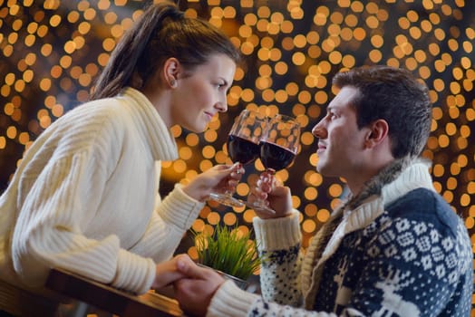 romantic evening date in restaurant  happy young couple with wine glass tea and cake