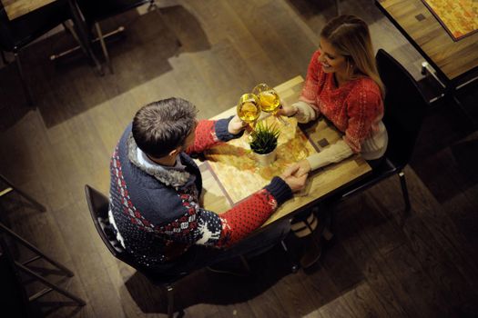 romantic evening date in restaurant  happy young couple with wine glass tea and cake