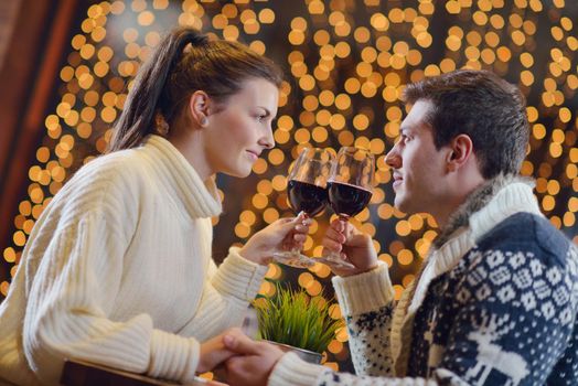 romantic evening date in restaurant  happy young couple with wine glass tea and cake