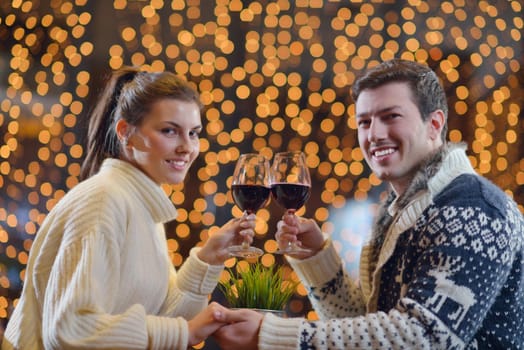 romantic evening date in restaurant  happy young couple with wine glass tea and cake