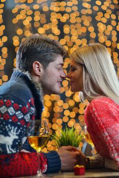 romantic evening date in restaurant  happy young couple with wine glass tea and cake