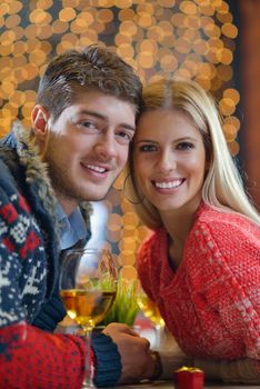 romantic evening date in restaurant  happy young couple with wine glass tea and cake