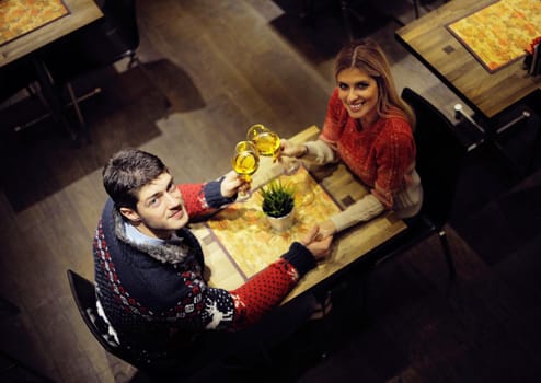 romantic evening date in restaurant  happy young couple with wine glass tea and cake