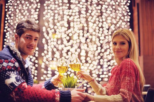 romantic evening date in restaurant  happy young couple with wine glass tea and cake