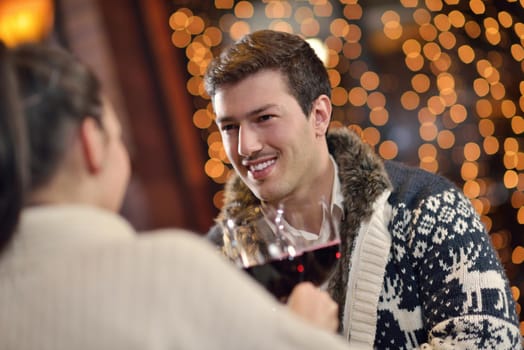 romantic evening date in restaurant  happy young couple with wine glass tea and cake