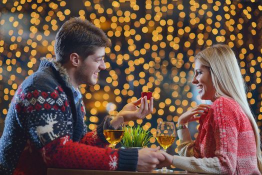 romantic evening date in restaurant  happy young couple with wine glass tea and cake