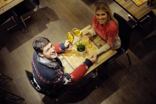 romantic evening date in restaurant  happy young couple with wine glass tea and cake