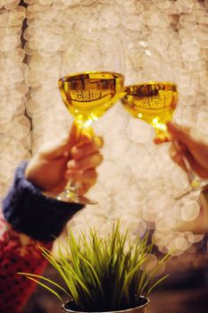 romantic evening date in hotel room, or supper in restaurant, happy couple with wine glass