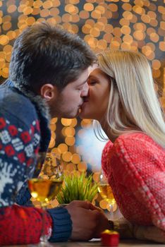 romantic evening date in restaurant  happy young couple with wine glass tea and cake