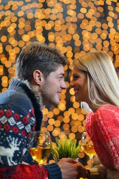 romantic evening date in restaurant  happy young couple with wine glass tea and cake