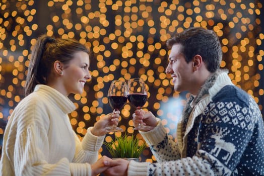 romantic evening date in restaurant  happy young couple with wine glass tea and cake