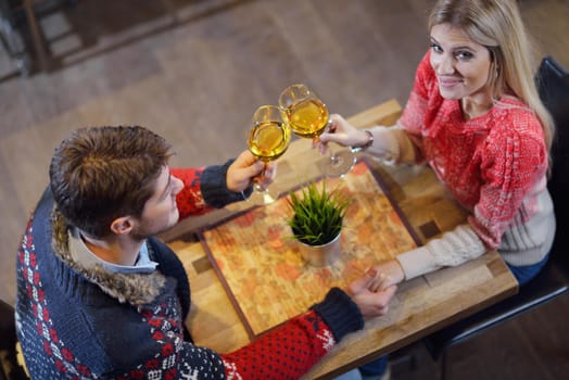 romantic evening date in restaurant  happy young couple with wine glass tea and cake