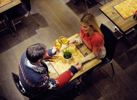 romantic evening date in restaurant  happy young couple with wine glass tea and cake