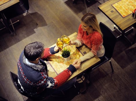 romantic evening date in restaurant  happy young couple with wine glass tea and cake