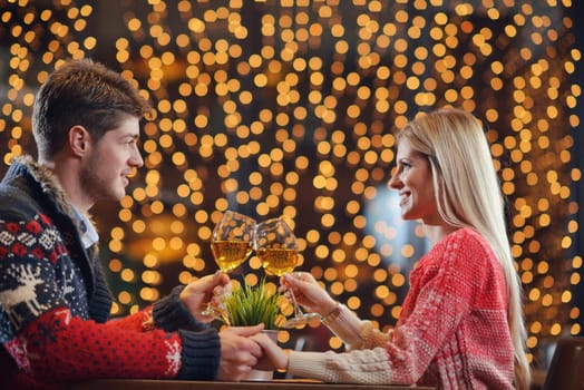 romantic evening date in restaurant  happy young couple with wine glass tea and cake