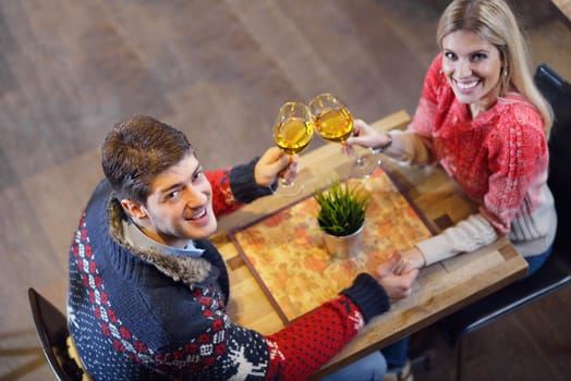 romantic evening date in restaurant  happy young couple with wine glass tea and cake