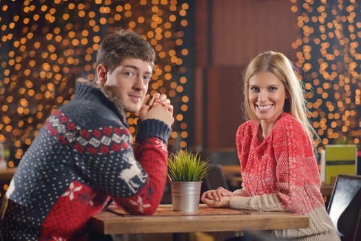 romantic evening date in restaurant  happy young couple with wine glass tea and cake