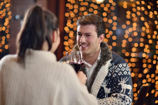 romantic evening date in restaurant  happy young couple with wine glass tea and cake