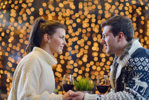 romantic evening date in restaurant  happy young couple with wine glass tea and cake