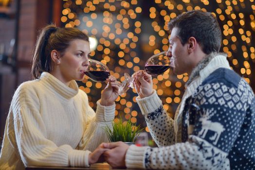 romantic evening date in restaurant  happy young couple with wine glass tea and cake