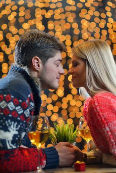 romantic evening date in restaurant  happy young couple with wine glass tea and cake