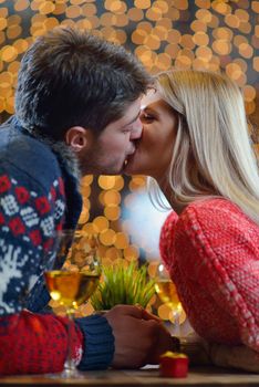 romantic evening date in restaurant  happy young couple with wine glass tea and cake