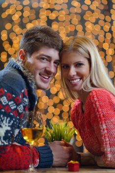 romantic evening date in restaurant  happy young couple with wine glass tea and cake