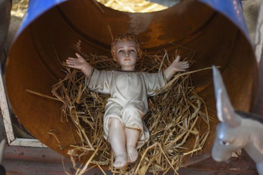 Baby Jesus laying in a cradle