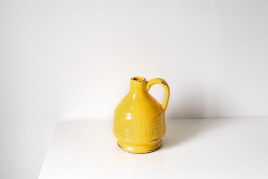 Yellow vase on a white background